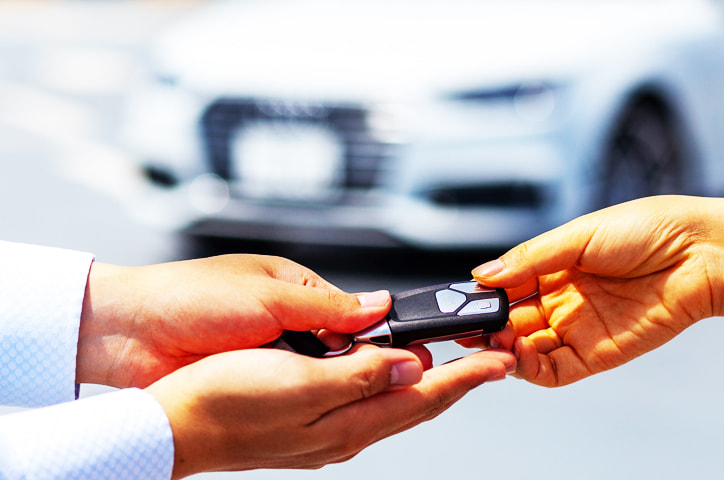 Handing over the keys to a rental car